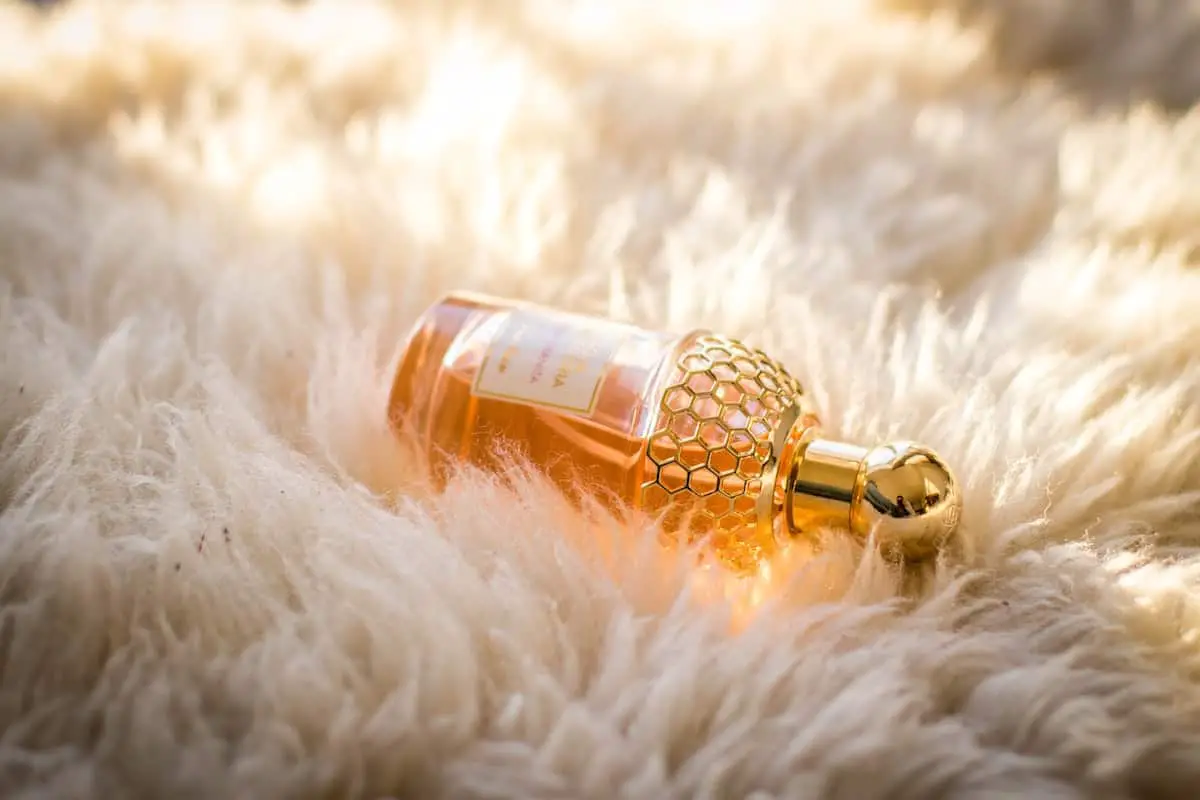 a bottle of perfume on the fur
